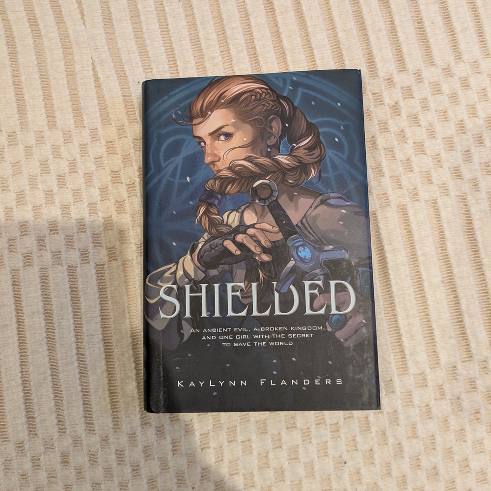 Shielded by KayLynn Flanders — Blue Illustrated Hardcover